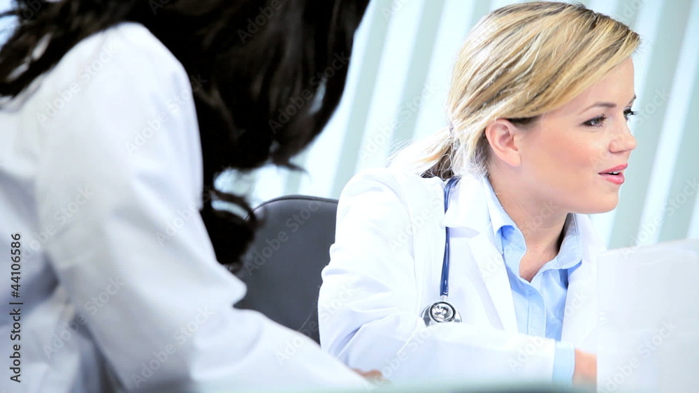 Diverse medical females agreeing treatment with handshake 