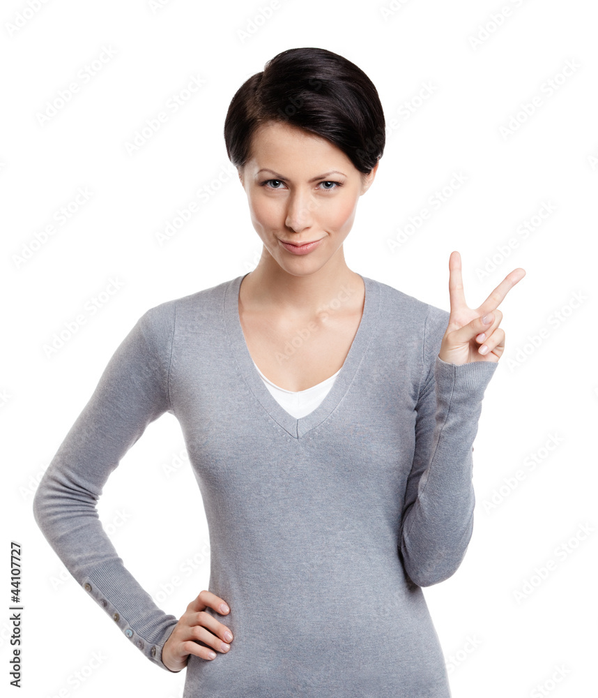 Smiley woman gestures peace sign, isolated on white Smiley woman gestures peace sign, isolated on white