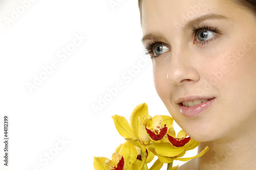 Attractive young woman face with flowers photo