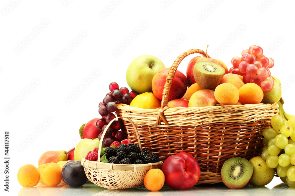 Assortment of exotic fruits and berries in baskets isolated Assortment of exotic fruits and berries in baskets isolated