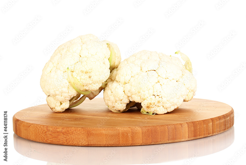 Fresh cauliflower on wooden board isolated on white Fresh cauliflower on wooden board isolated on white
