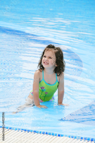 happy girl in the swimming in swimming suit