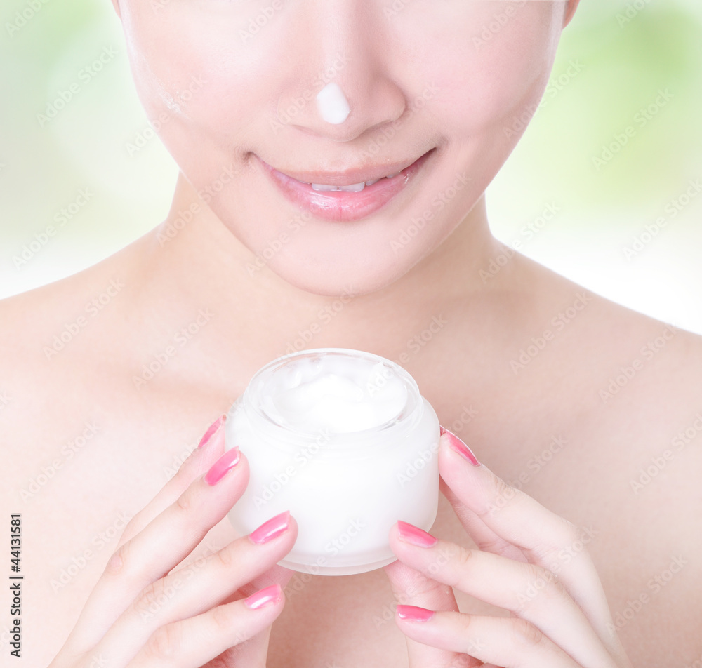 woman smile with moisturizer cream woman smile with moisturizer cream