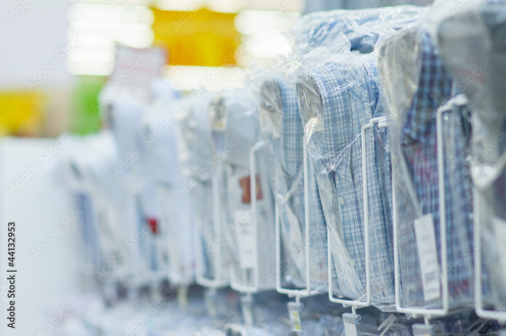 Packed shirts on stand in supermarket Packed shirts on stand in supermarket