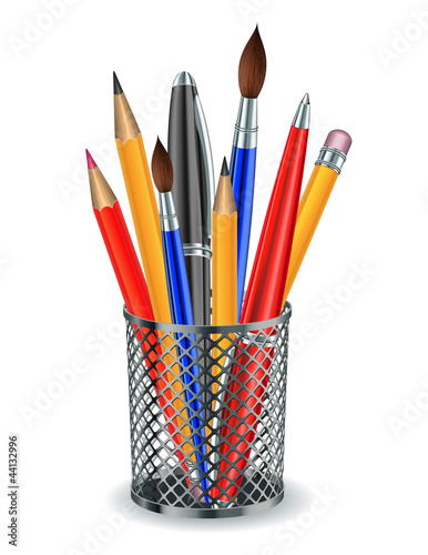 Brushes, pencils and pens in the holder.
