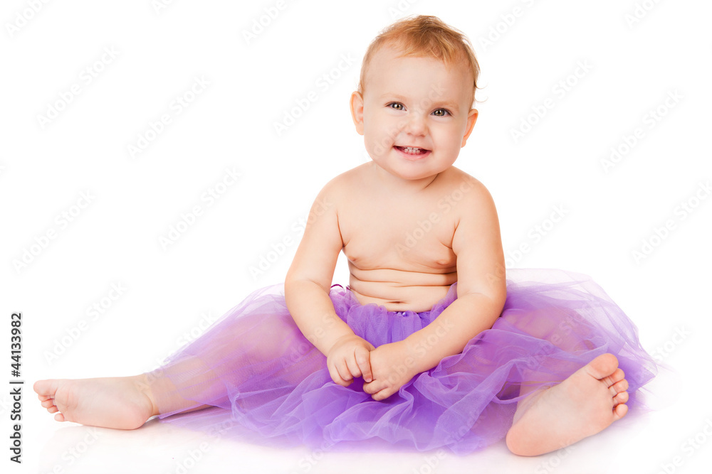 Cheerful little girl in a purple skirt Cheerful little girl in a purple skirt