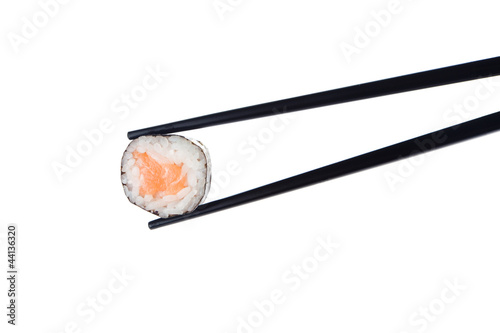 Sushi roll with chopsticks, isolated