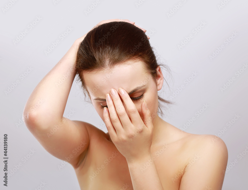 Young woman with head pain on white background Young woman with head pain on white background