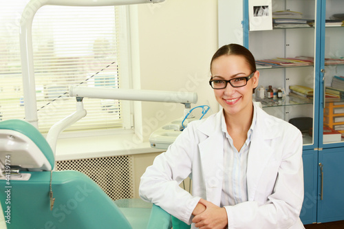 woman dentist at her office smiling