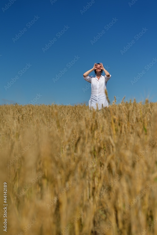young woman in wheat field at summer young woman in wheat field at summer