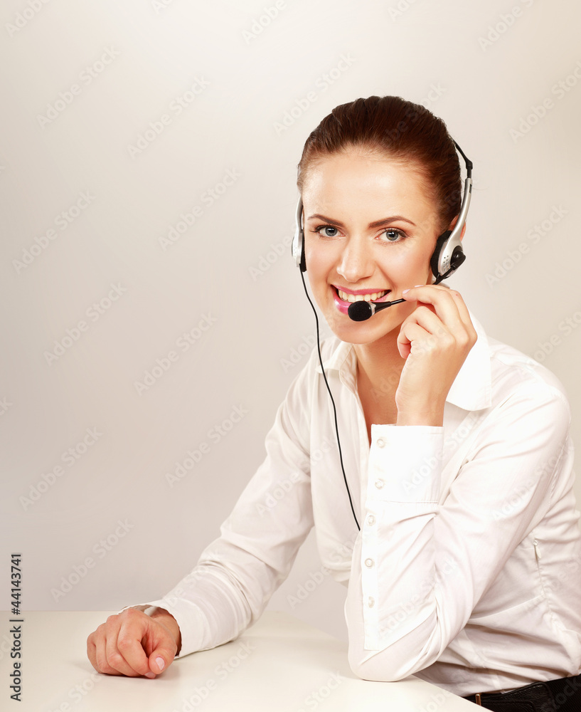 A smiling customer service girl isolated on white background A smiling customer service girl isolated on white background