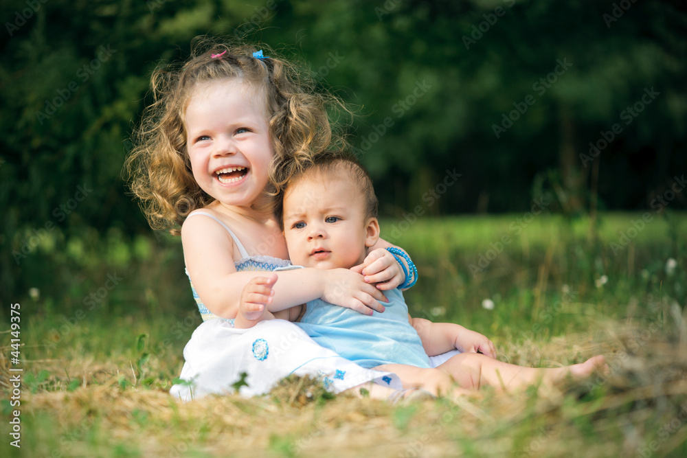 Cute children are playing in park Cute children are playing in park