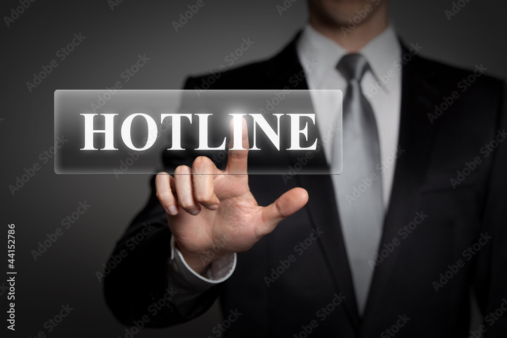 businessman pressing virtual button - hotline businessman pressing virtual button - hotline