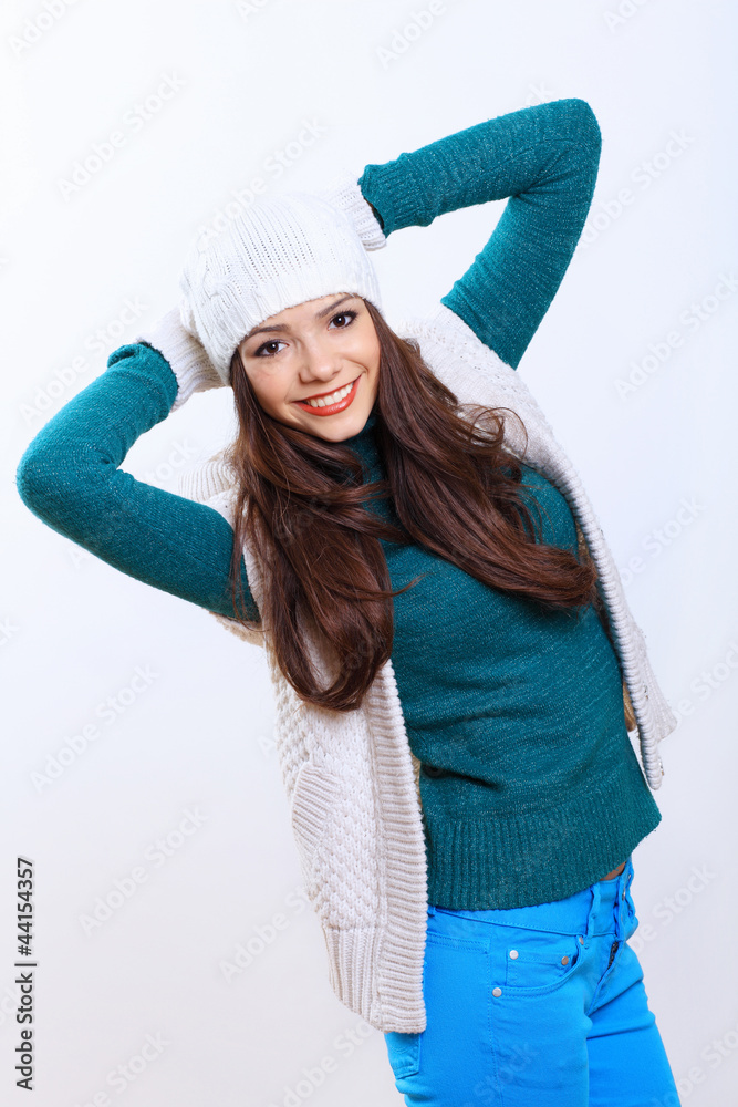 Young woman wearing winter hat and warm scarf