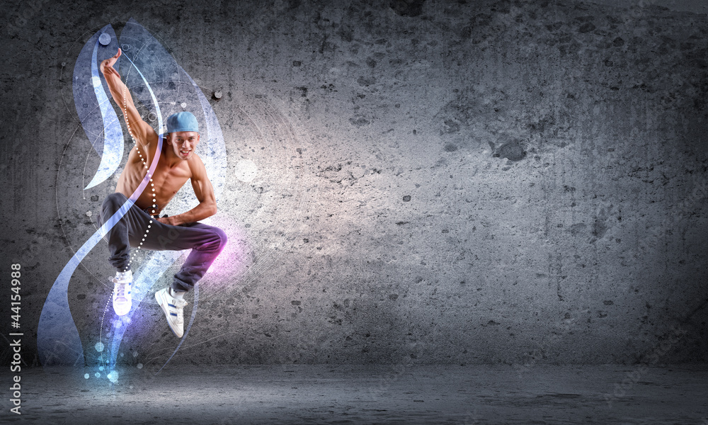 Obraz premium young man dancing hip hop with color lines