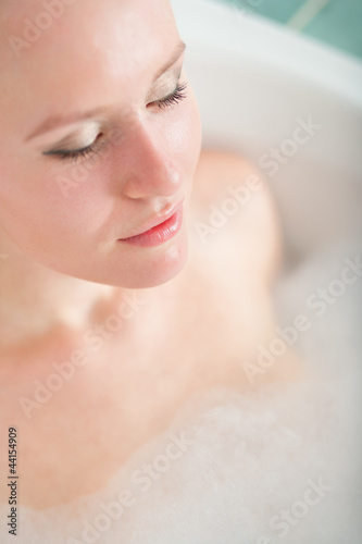 Bath woman enjoying bahub. Naturaly beautiful female relaxing