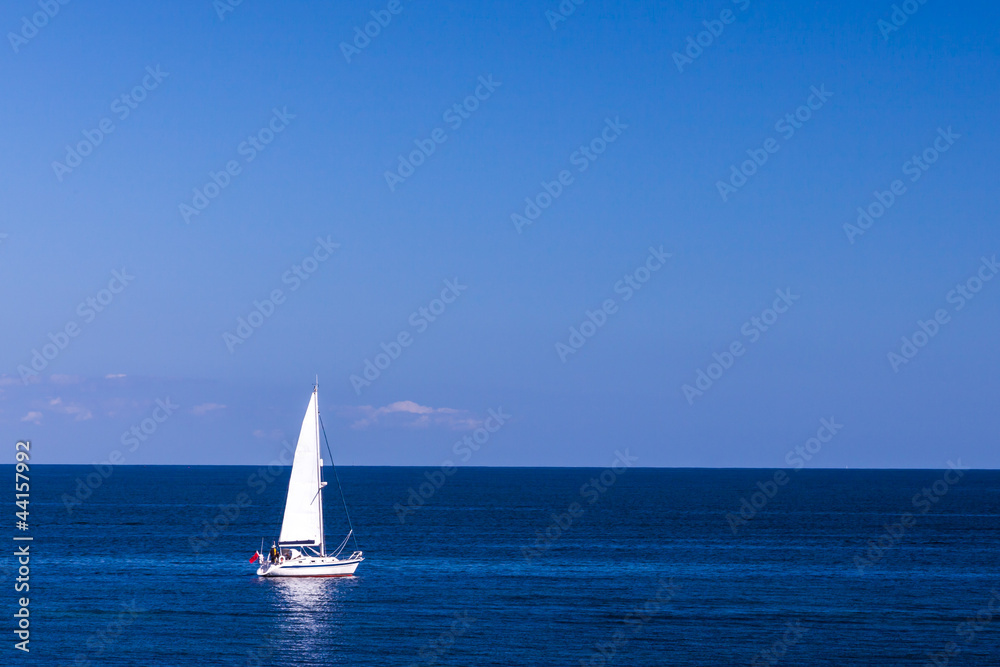 Isolated Yacht in the blue sea
