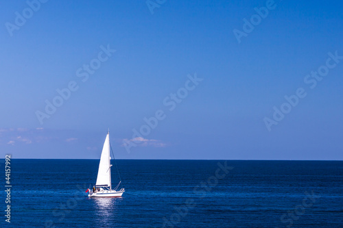 Isolated Yacht in the blue sea