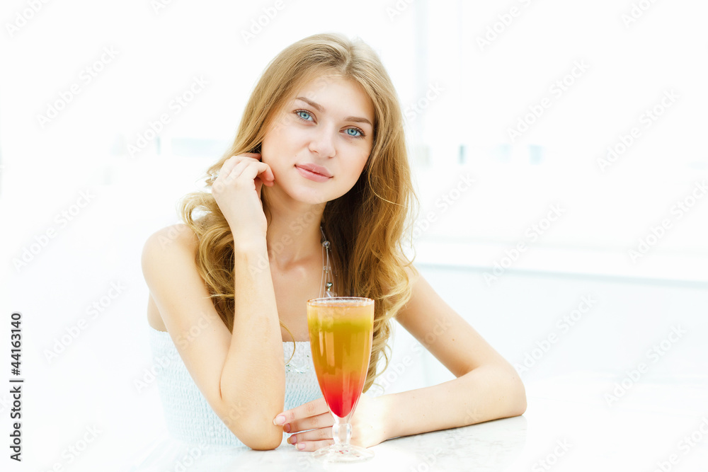 Young woman with a glass of drink Young woman with a glass of drink