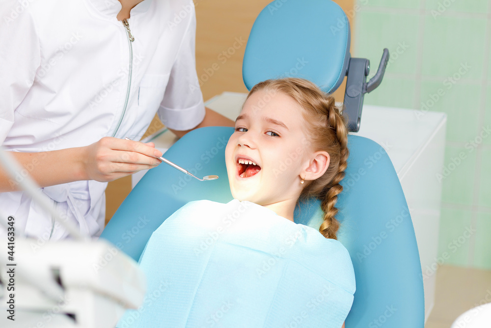 Little girl visiting dentist