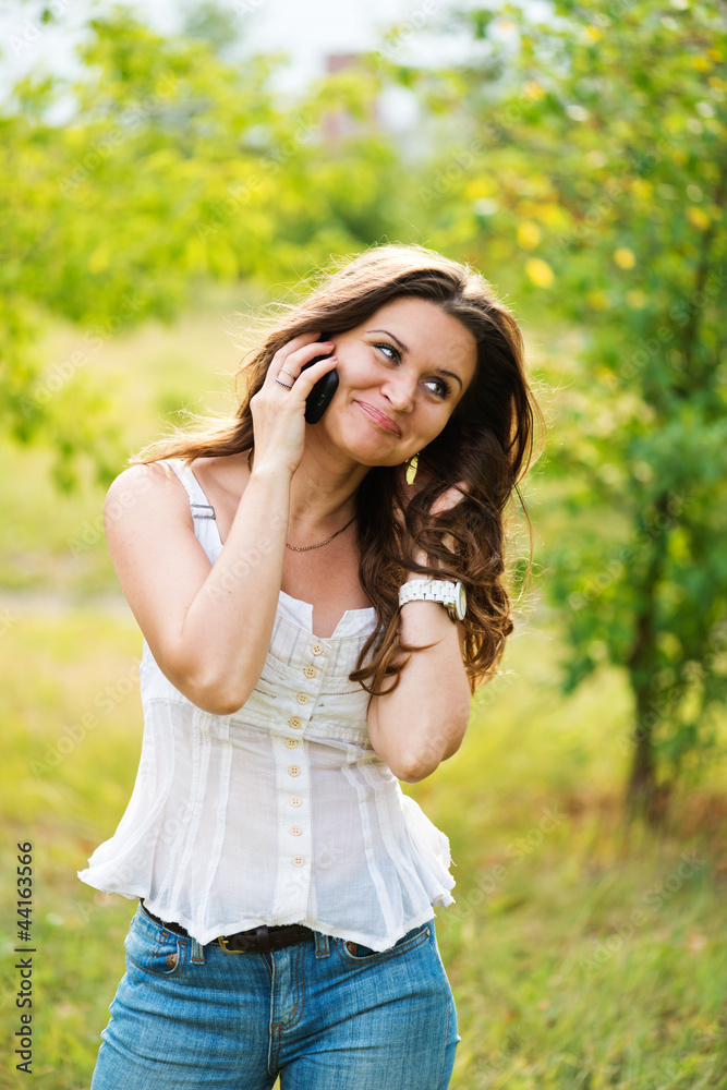 Outdoor portrait of young woman with phone Outdoor portrait of young woman with phone