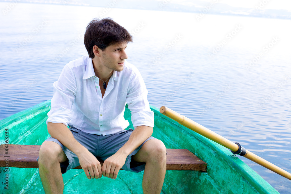 Handsome man relaxing on boat