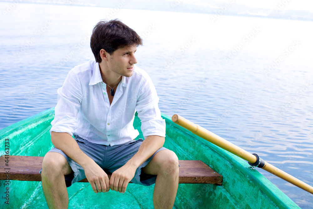 Fototapeta premium Handsome man relaxing on boat