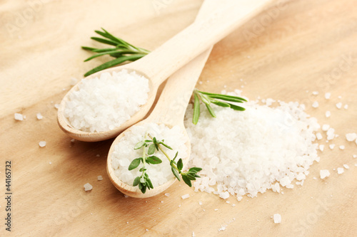 salt in spoons with fresh  rosemary and thyme