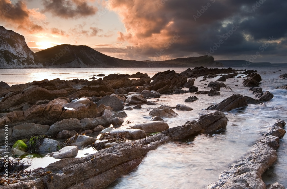 Sunrise ocean landscape Mupe Bay Jurassic Coast England
