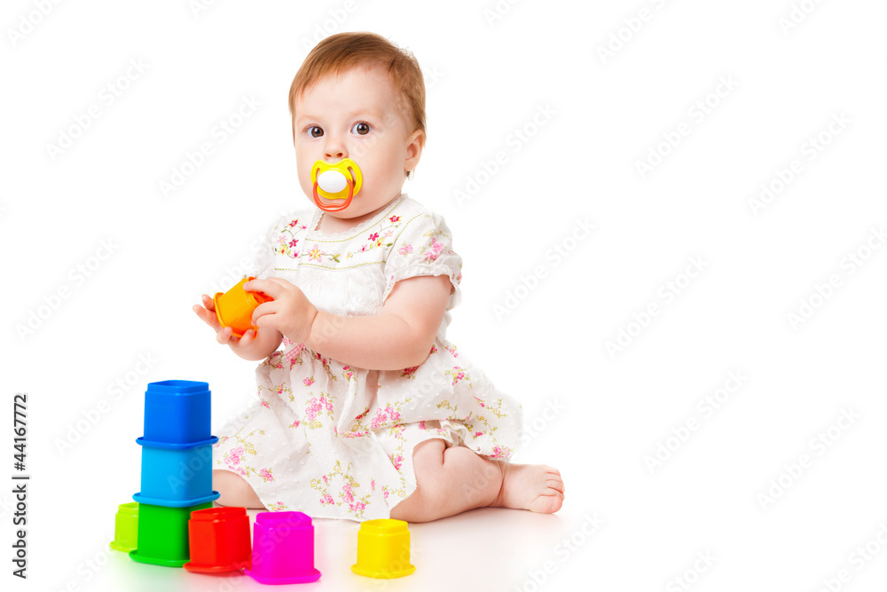Little girl with a toys, isolated on white Little girl with a toys, isolated on white