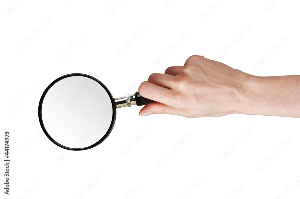 Magnifier glass in woman hand isolated on white Magnifier glass in woman hand isolated on white