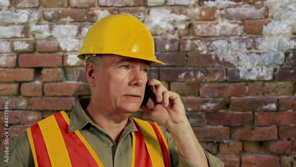 construction guy on a cell phone construction guy on a cell phone