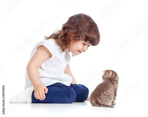 Funny child sitting on floo...