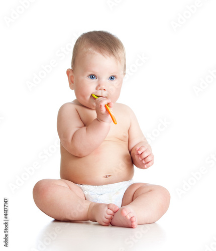 little baby brushing gums o...