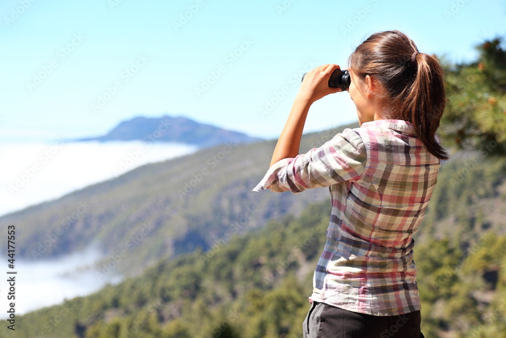 Hiker looking in binoculars