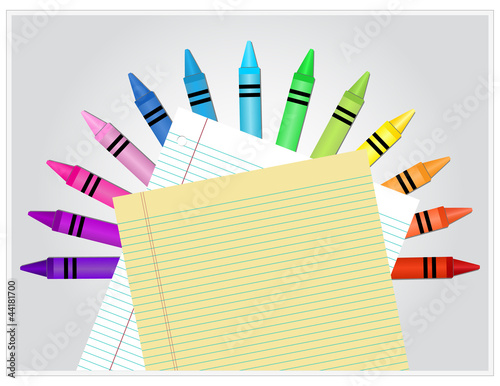 Crayons behind white and yellow lined paper