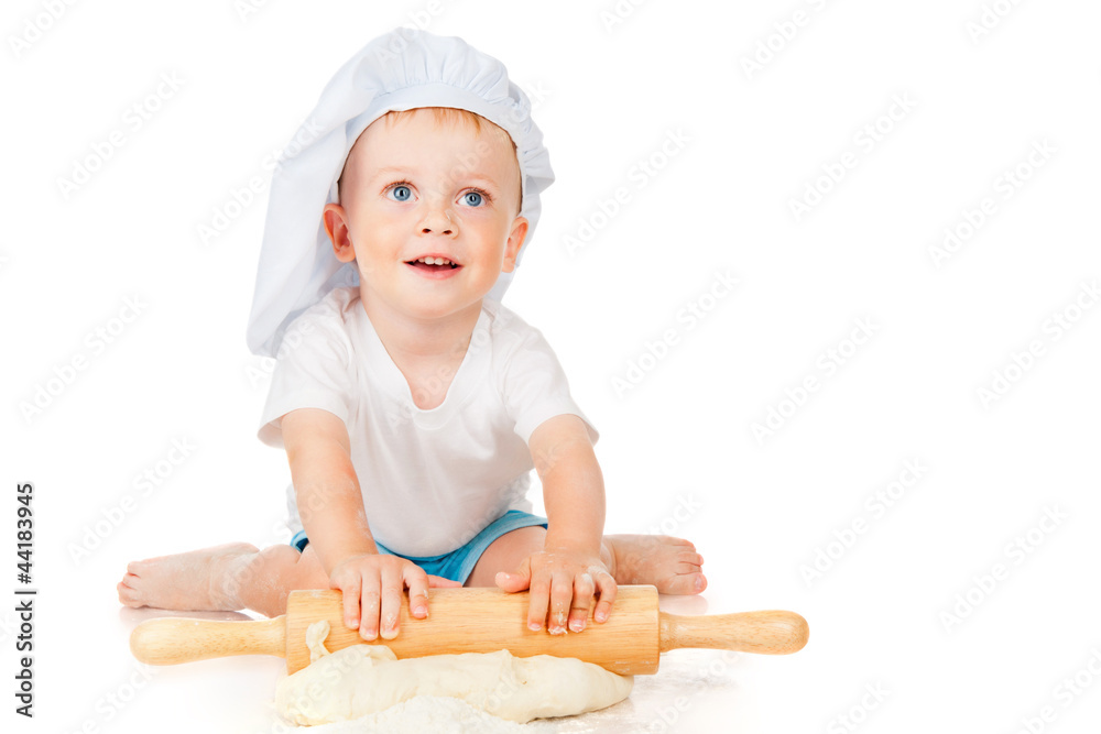 The little boy rolls the dough The little boy rolls the dough