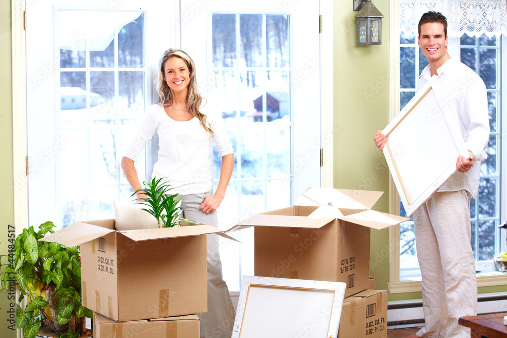 Happy couple moving in a new house. Happy couple moving in a new house.