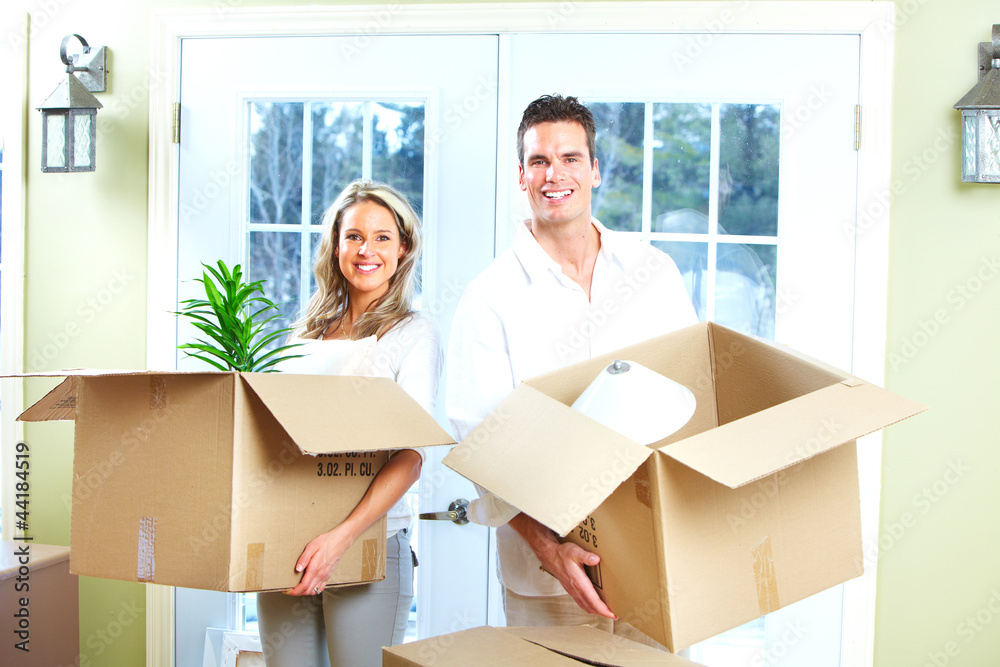 Happy couple moving in a new house. Happy couple moving in a new house.