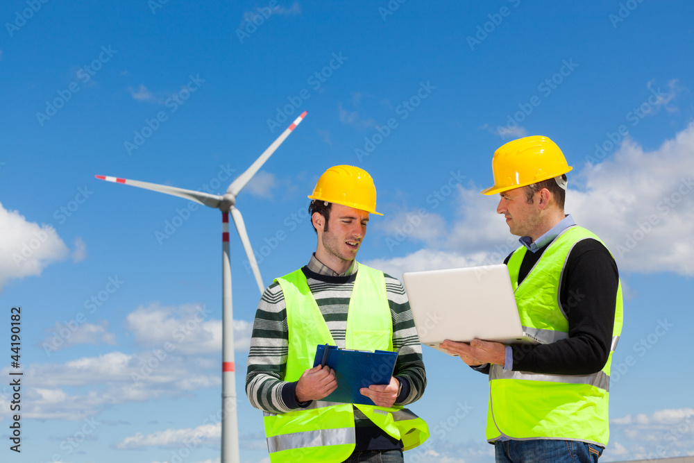Two Engineers in a Wind Turbine Power Station Two Engineers in a Wind Turbine Power Station