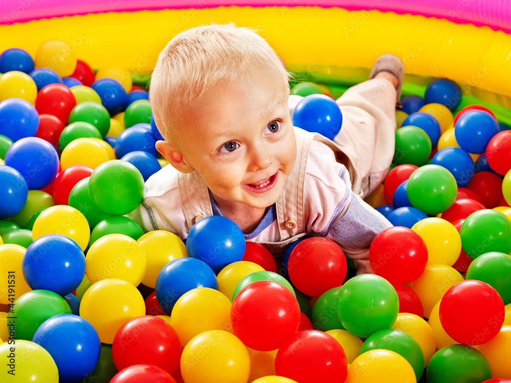 Child in colored ball. Child in colored ball.