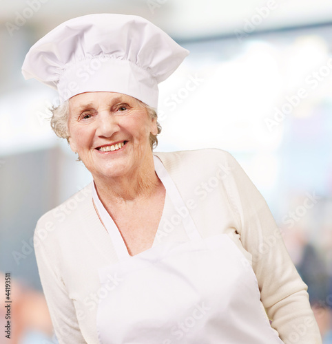 portrait of cook senior woman smiling indoor