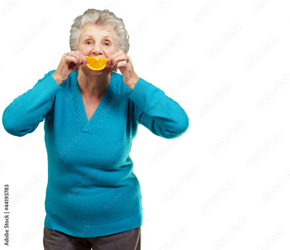 Mature Woman With A Slice Of Fruit