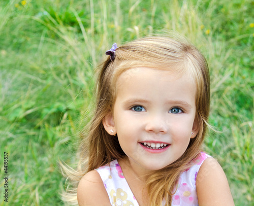 Cute little girl on the meadow