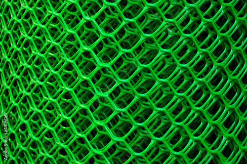 Roll of a green plastic net for a fence