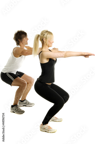 Man and woman working out isolated on a white background