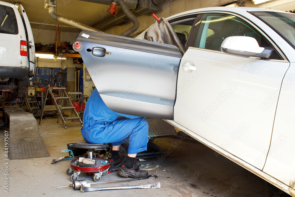The car door is being changed in repair service