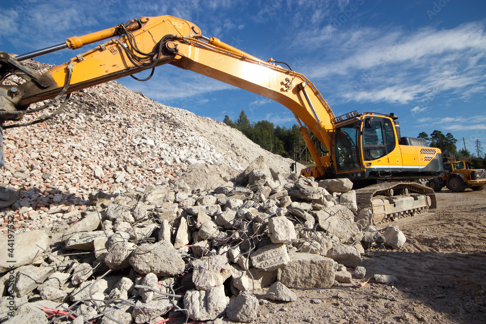 Construction demolition waste and excavator