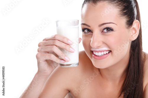 Funny young woman drinking yogurt