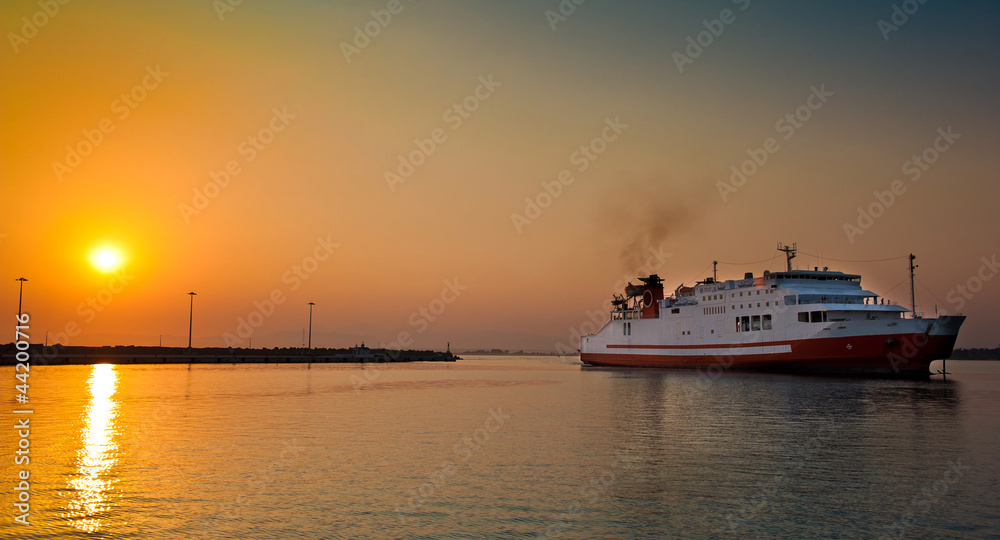 view of passenger ferry boat in open waters in Greece at sunrise